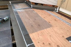 First stage of ‘Westcoat ALX reinforced metal lath waterproofing system ‘This is a high-end proven system appropriate for wood subfloors with unmatched strength and durability.  Metal lath being laid on subfloor