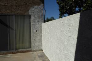Stucco completion at unit
