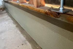 Beautiful new concrete foundation stem finished with edge bevel. Anchor rods plated and top nuts tightened