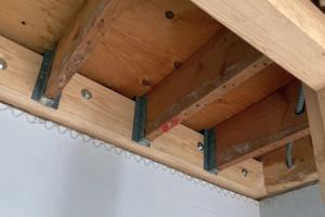 New beam fastened to existing - existing joists fastened to new beam