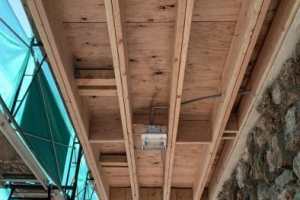 Perpendicular double joists connected to new cantilevered beams at 1st floor front balcony