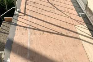 Floor sheathing, floor to wall flashing, pan flashing at slider and edge flashing installed at side balcony