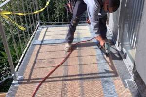 Westcoat ALX metal reinforced waterproofing system being installed. Fiberlath membrane installed at plywood sheathing joints and metal lath stapled to complete floor system to stabilize subfloor bond with new waterproofing system