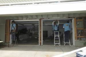 Wood epoxy application as needed to finish garage header repair and installation of garage door jambs